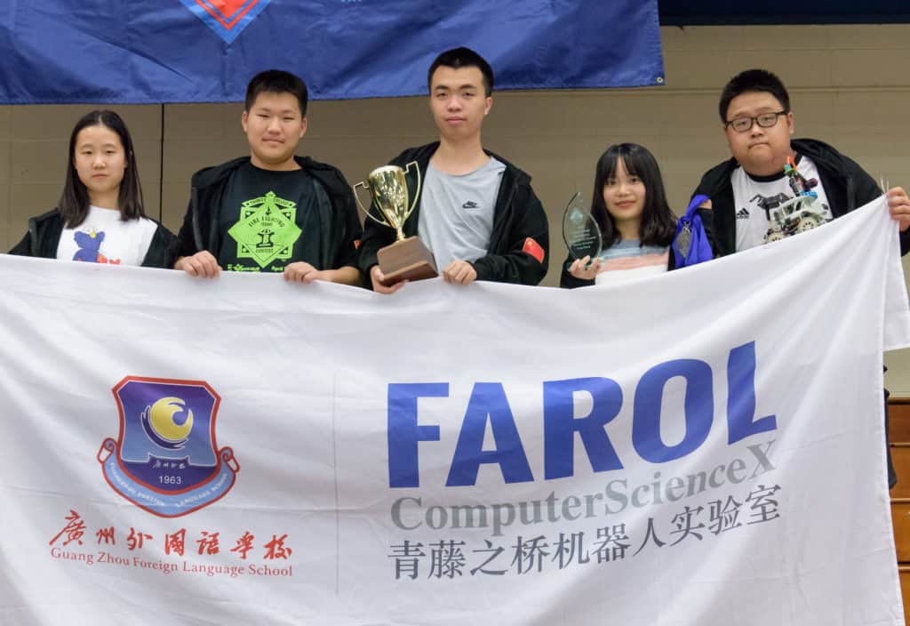 Guangzhou Foreign Language School robot team celebrates.