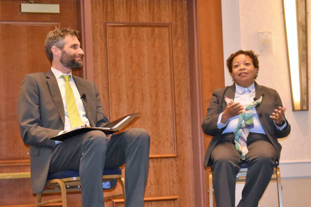 Trinity President Joanne Berger-Sweeney (left) with Joel N. Lohr, president of Hartford Seminary.